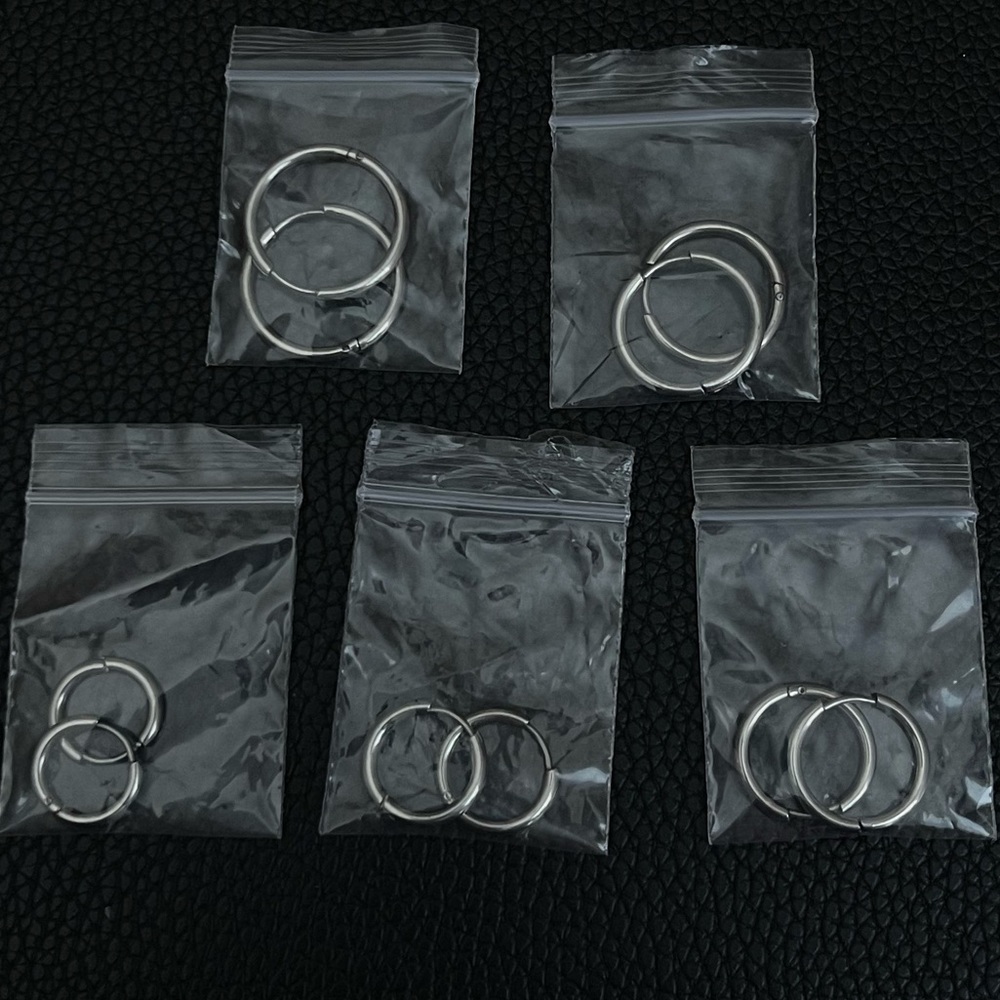 Five pairs of sterling silver hoops